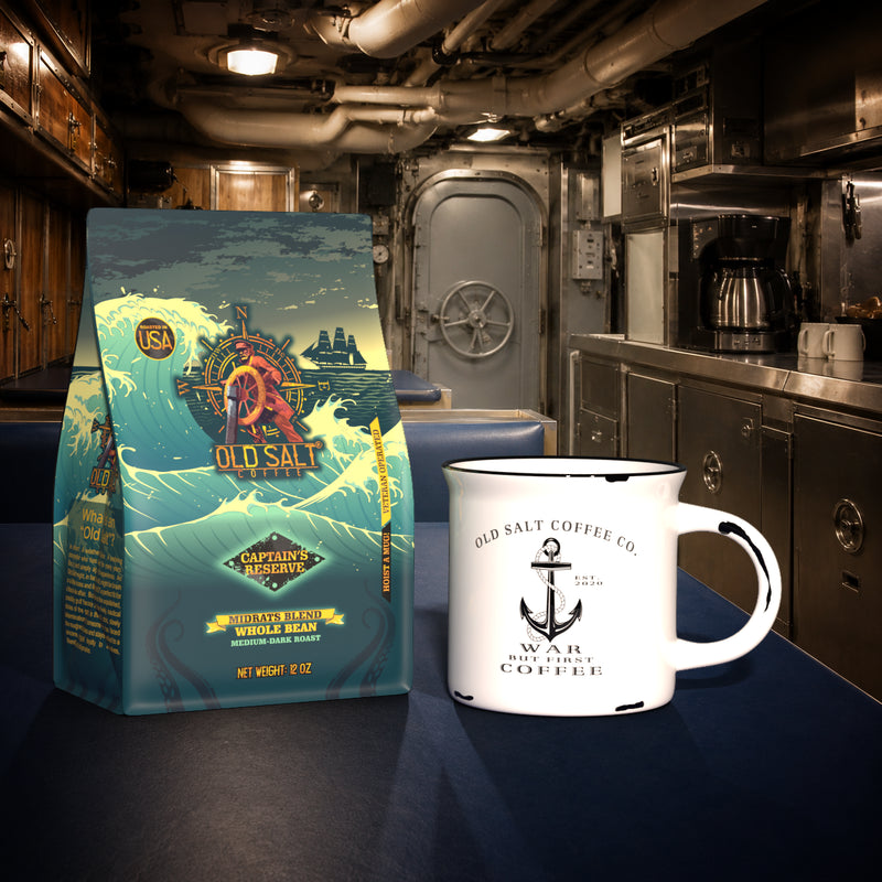 Old Salt Coffee's Captain's Reserve: Midrats Blend in 12oz resting beside an Old Salt ceramic mug in a crew's mess on a navy ship.